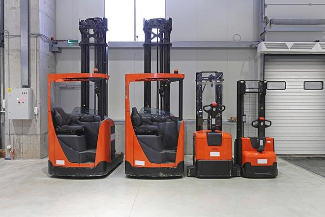 worker operating forklift in industrial setting